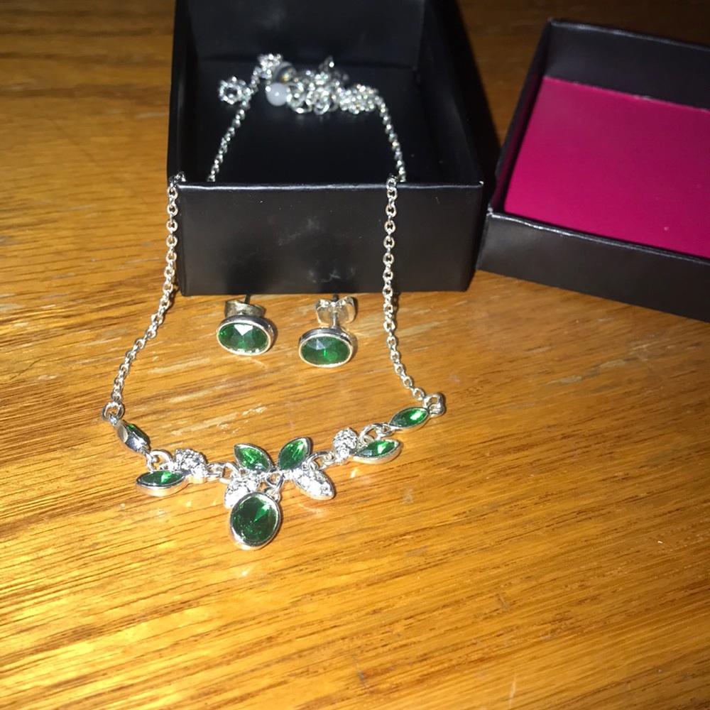 Green necklace, diamonds/gems, matching earrings.